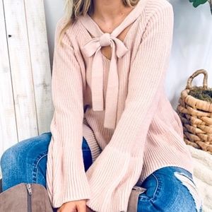 Pink sweater with unique sleeves and bow tie